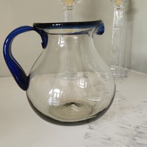 Artisan Clear Glass Pitcher with Blue Rim and Handle